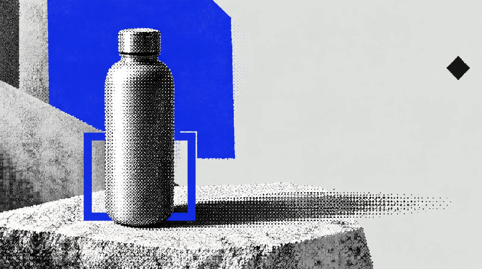 A blank bottle is arranged with tactile materials and warm directional light in a simple setting.
